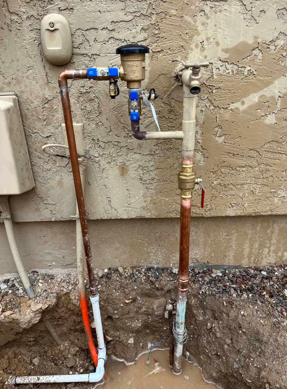 Irrigation system plumbing installation with copper and PVC piping